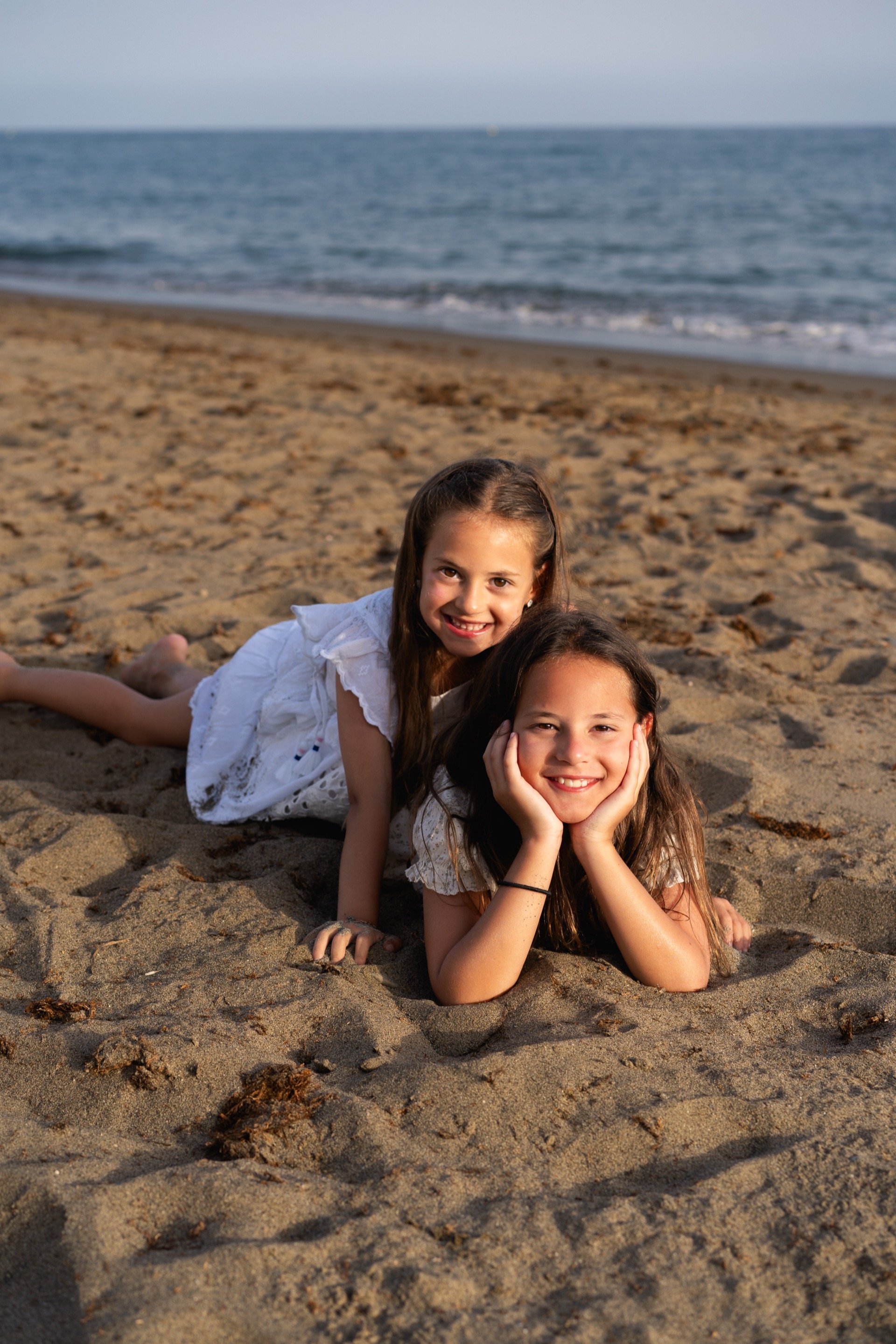 Happy family portrait at Marbella beach sunset