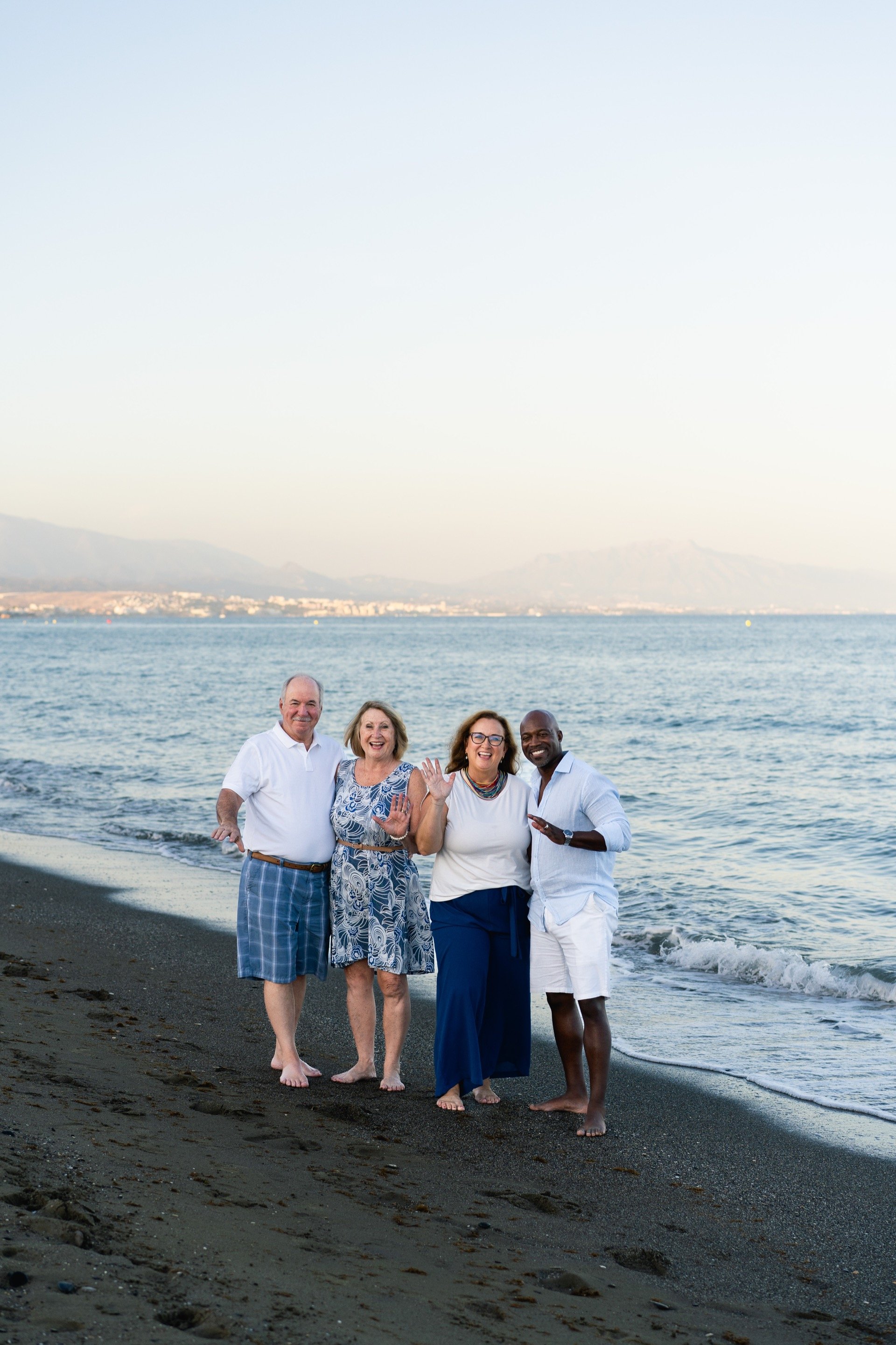 Family beach portrait with mountain backdrop